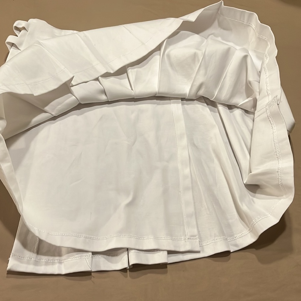 Pleated white mini skirt with no shorts underneath. - Picture 3 of 8